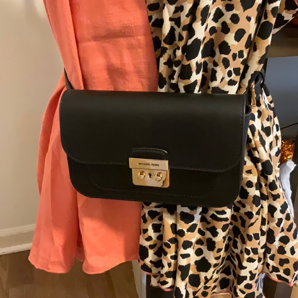 Brand New: Michael Kors -Black small flap belt bag.